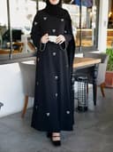 Elegant long dress with bow embroidery for Muslim women in the Middle East – Ramadan style.